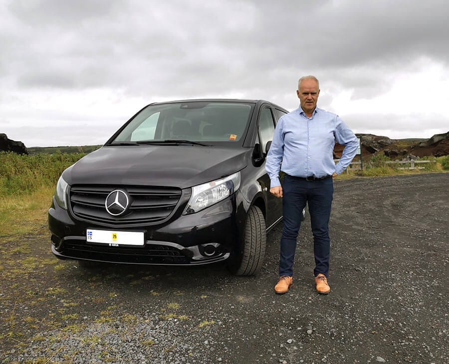Thorsteinn Gunnar Kristjansson beside the Salty Tours Mercedes minivan