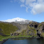 Snaefelsjokull glacier moss covered lava fileds blue sky volcano lake