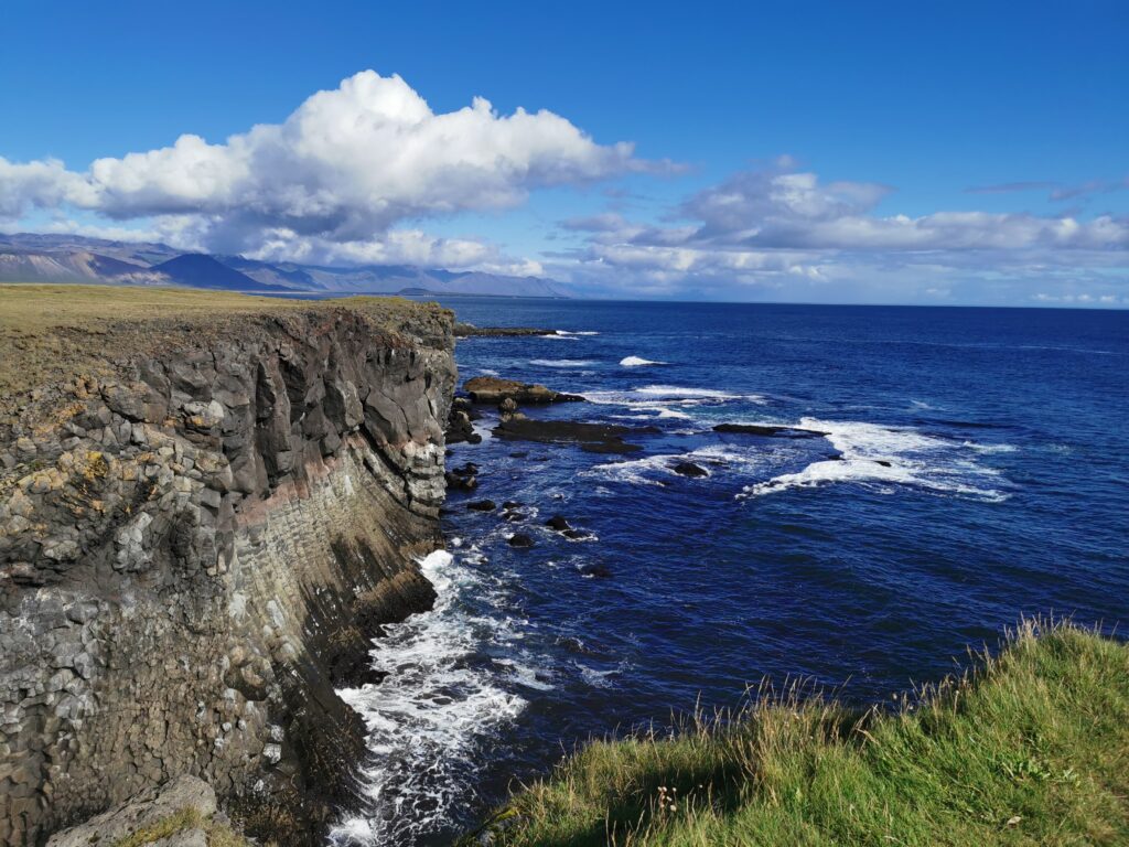 Arnarstapi sea cliffs with blue see and sky